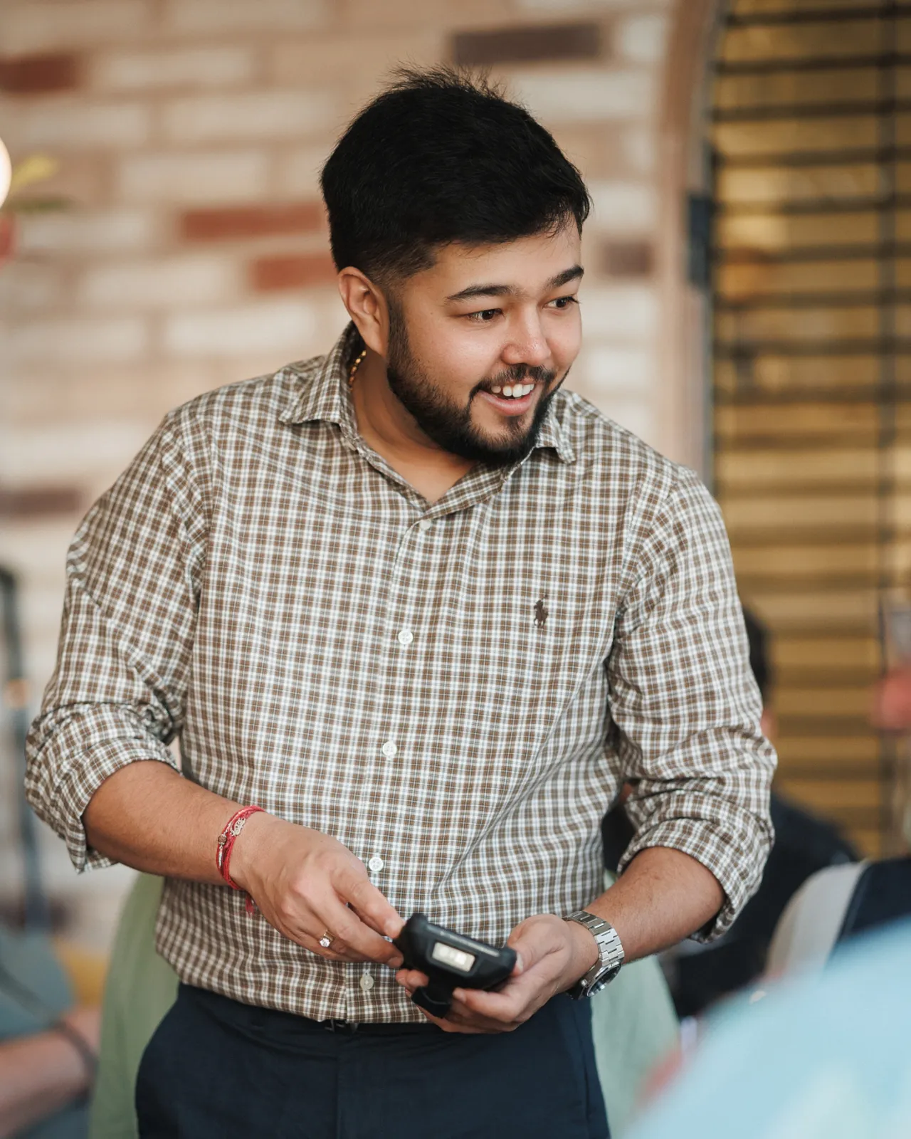 Ankit, owner and co-founder of Padharo, serving guests in the restaurant