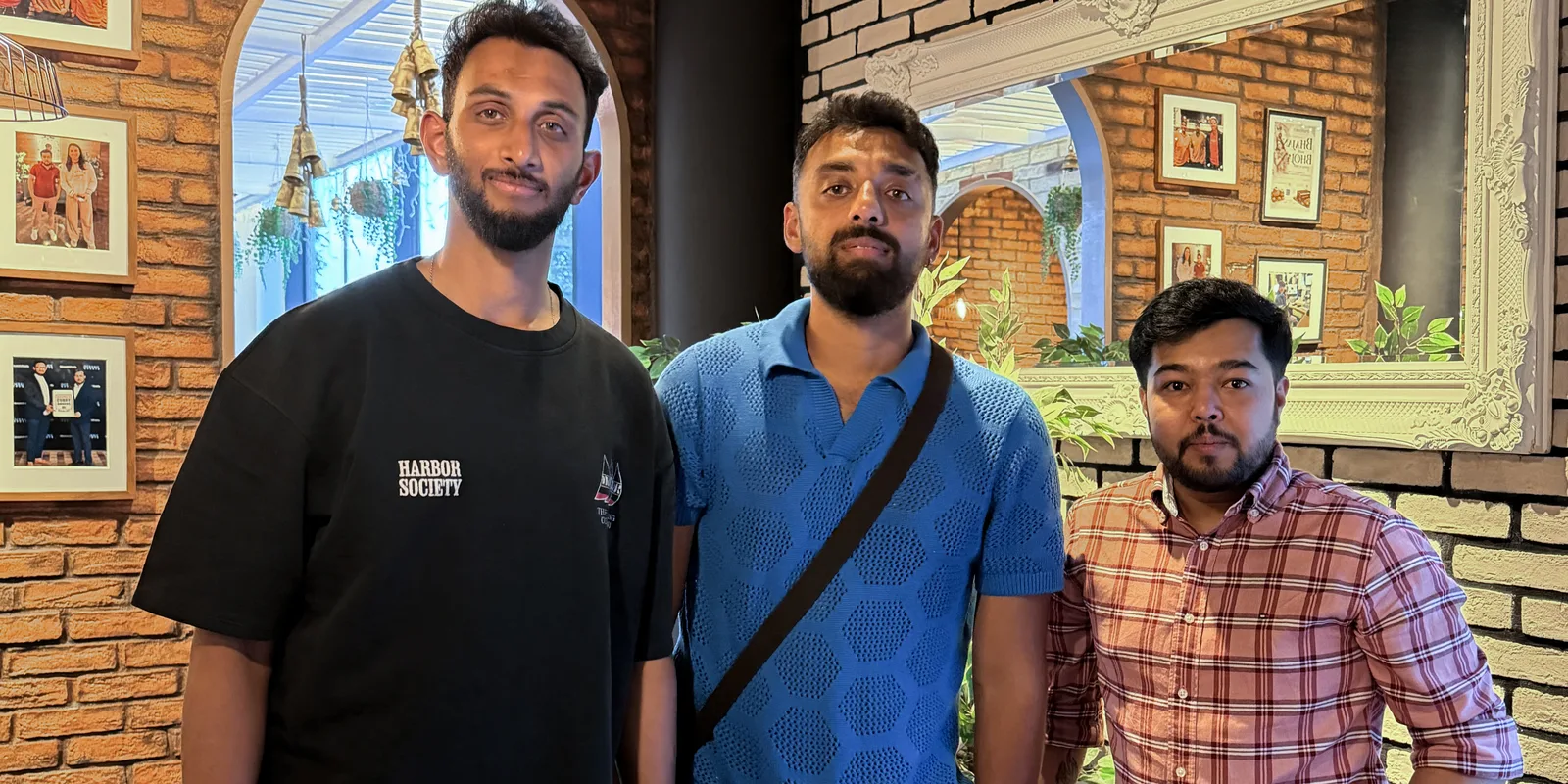 Prasidh Krishna and Varun Chakaravarthy of the India men’s cricket team with Padharo owner Ankit inside the restaurant, July 2026