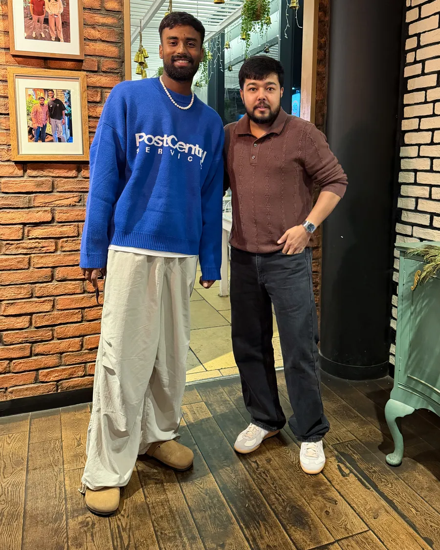 Manav Suthar, India left-arm spinner, with Padharo owner Ankit at the restaurant entrance in Southampton, September 2026