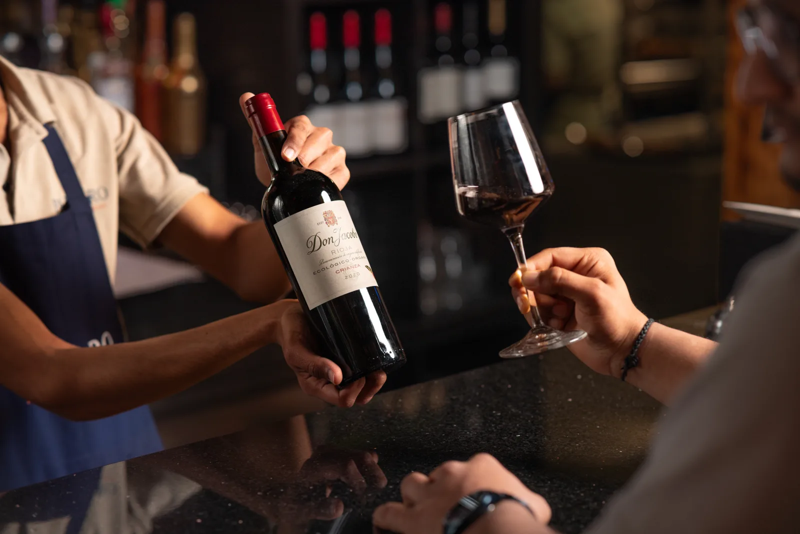 Glass of red wine being poured at Padharo Indian restaurant