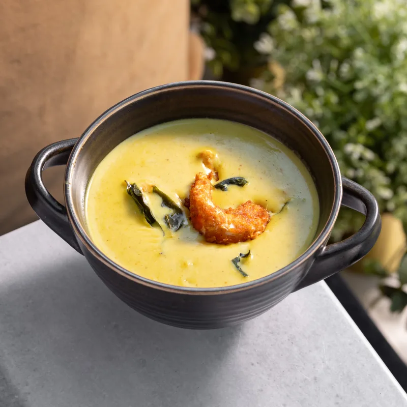 Konkan Prawn Curry — Coastal Maharashtrian curry - our vegan prawns simmered in coconut and tomato gravy, vegetarian Indian dish at Padharo Southampton