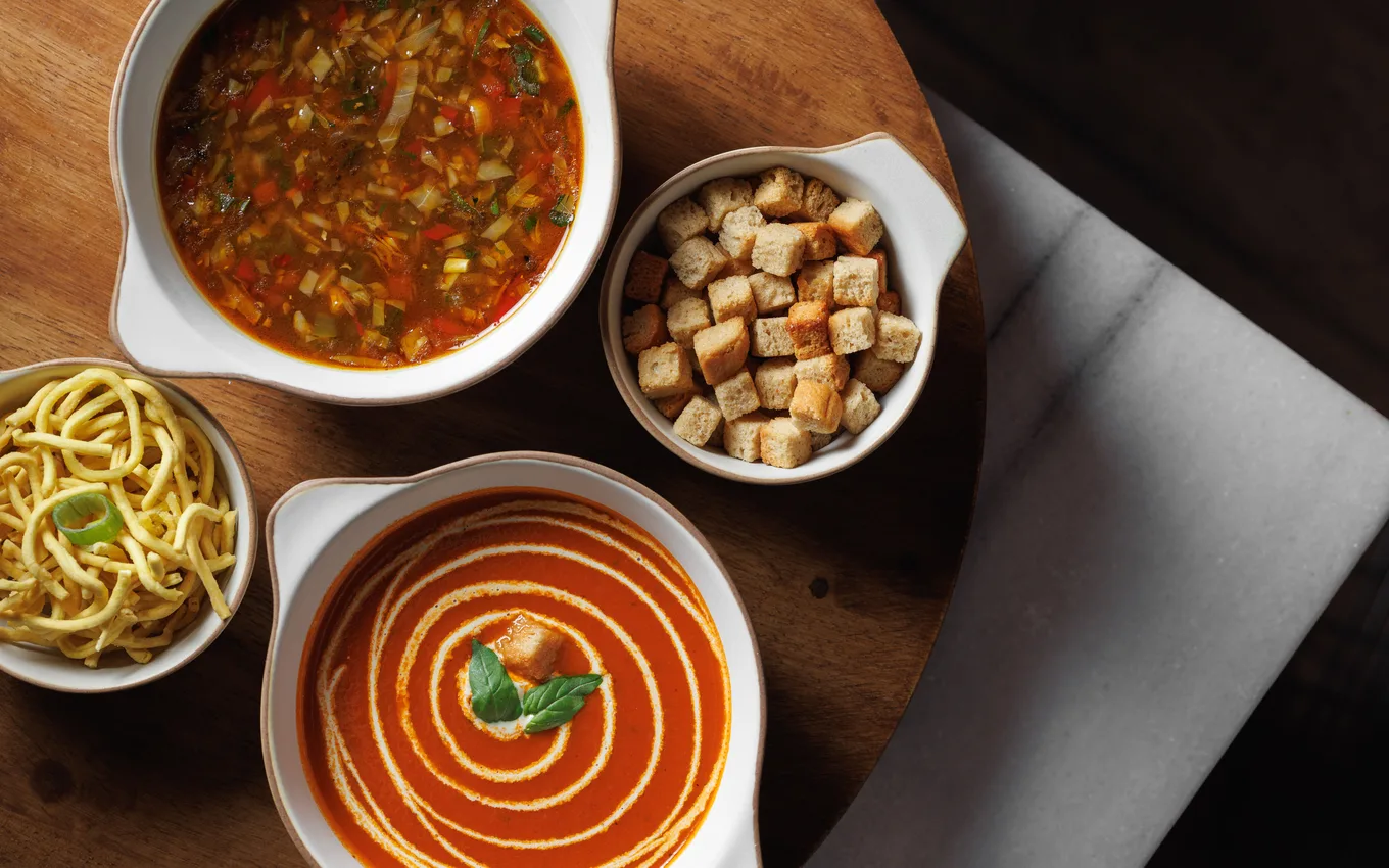 Padharo's winter soups: creamy tomato and vegetable manchow with crispy noodles and croutons